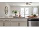 Modern kitchen features white cabinets, marble countertops, and stainless steel appliances at 229 Abercom Place Dr, Moncks Corner, SC 29461