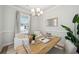Bright home office features a wood desk, two armchairs, and stylish decor at 229 Abercom Place Dr, Moncks Corner, SC 29461