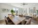 Open floor plan with dining table and living area with comfy seating at 229 Abercom Place Dr, Moncks Corner, SC 29461