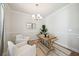 Home office with hardwood floors, white wainscoting, and a rustic wooden desk at 229 Abercom Place Dr, Moncks Corner, SC 29461