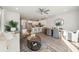 Open living room and kitchen with hardwood floors, island, and modern appliances at 229 Abercom Place Dr, Moncks Corner, SC 29461