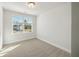 Bright bedroom with carpeted floor and a large window at 229 Abercom Place Dr, Moncks Corner, SC 29461