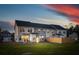 Three-unit townhome building with fenced backyard and grassy area at 229 Abercom Place Dr, Moncks Corner, SC 29461