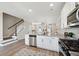 Open concept kitchen features granite island and stainless steel appliances at 205 Abercom Place Dr, Moncks Corner, SC 29461