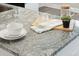 Granite countertop detail showcasing a stylish and functional kitchen design at 205 Abercom Place Dr, Moncks Corner, SC 29461