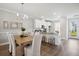 Modern dining room with a wood table and white chairs at 205 Abercom Place Dr, Moncks Corner, SC 29461