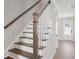 Elegant staircase with dark wood and white railings at 205 Abercom Place Dr, Moncks Corner, SC 29461