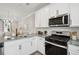 Modern kitchen with granite countertops and stainless steel appliances at 205 Abercom Place Dr, Moncks Corner, SC 29461