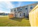 Private backyard with wooden fence and patio at 205 Abercom Place Dr, Moncks Corner, SC 29461