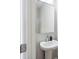 Small bathroom with pedestal sink and contemporary mirror at 205 Abercom Place Dr, Moncks Corner, SC 29461