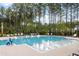 Resort-style pool with plenty of lounge chairs and a pool house at 732 Breakers Reef Ln, Huger, SC 29450