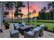 Relaxing patio with fire pit and seating area, overlooking a pond at 377 Tupelo Lake Dr, Summerville, SC 29486
