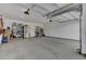 Spacious garage with overhead storage and refrigerator at 377 Tupelo Lake Dr, Summerville, SC 29486