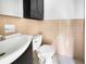 Small bathroom with beige tile, white sink and toilet at 219 Owens Dr, Summerville, SC 29485
