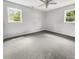 Empty bedroom with grey carpet, ceiling fan and windows at 219 Owens Dr, Summerville, SC 29485