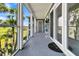 Screened balcony overlooking marsh views and palm trees at 100 Mariners Cay Dr, Folly Beach, SC 29439