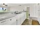 White kitchen with updated appliances at 100 Mariners Cay Dr, Folly Beach, SC 29439