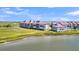 Aerial view of condo building near waterway at 100 Mariners Cay Dr, Folly Beach, SC 29439