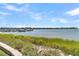 Boats docked at a marina, with marsh grasses in the foreground at 100 Mariners Cay Dr, Folly Beach, SC 29439