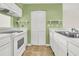 Efficient galley kitchen with white cabinets at 100 Mariners Cay Dr, Folly Beach, SC 29439