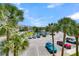 Parking lot with pond and palm trees at 100 Mariners Cay Dr, Folly Beach, SC 29439
