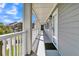 Bright condo hallway with white railings at 100 Mariners Cay Dr, Folly Beach, SC 29439