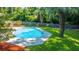 Octagonal pool surrounded by lush landscaping and palm trees at 181 Pekoe Ct, Summerville, SC 29483