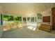 Screened porch with pool view and wooden steps at 181 Pekoe Ct, Summerville, SC 29483