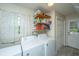 Laundry room with washer, dryer, and shelving at 181 Pekoe Ct, Summerville, SC 29483