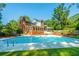Inviting backyard pool with large brick home at 181 Pekoe Ct, Summerville, SC 29483
