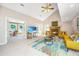 Open living room with vaulted ceiling, fireplace and sunroom at 181 Pekoe Ct, Summerville, SC 29483