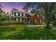 Brick house with large front yard, porch and mature trees at 181 Pekoe Ct, Summerville, SC 29483