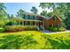Brick house with large front yard, porch and mature trees at 181 Pekoe Ct, Summerville, SC 29483