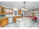 Spacious kitchen with granite island, stainless steel appliances, and wood cabinetry at 181 Pekoe Ct, Summerville, SC 29483