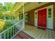 Front porch with red door and white columns at 181 Pekoe Ct, Summerville, SC 29483