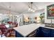 Bright kitchen features a white quartz island with blue cabinets, and a dining area at 1637 Live Oak Park, Seabrook Island, SC 29455