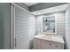 Spa-like bathroom with a white vanity, shiplap walls, and a walk-in shower at 1637 Live Oak Park, Seabrook Island, SC 29455