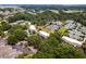 Aerial view of community featuring tennis courts, clubhouse, and lush landscaping at 1637 Live Oak Park, Seabrook Island, SC 29455
