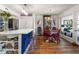 Open concept kitchen with a large island, blue cabinets, and a charming dining area at 1637 Live Oak Park, Seabrook Island, SC 29455