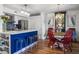 Modern kitchen with blue island, stainless steel appliances, and hardwood floors at 1637 Live Oak Park, Seabrook Island, SC 29455