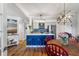 Modern kitchen with blue island, stainless steel appliances, and hardwood floors at 1637 Live Oak Park, Seabrook Island, SC 29455