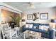 Relaxing sunroom, featuring a blue couch and access to a deck at 1637 Live Oak Park, Seabrook Island, SC 29455