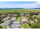 Aerial view showcasing community amenities including tennis courts and waterfront access at 1637 Live Oak Park, Seabrook Island, SC 29455