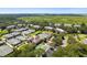 Aerial view of community with tennis courts, a clubhouse, and marsh views at 1637 Live Oak Park, Seabrook Island, SC 29455