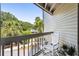 Relaxing balcony with rocking chair and view of lush greenery at 1637 Live Oak Park, Seabrook Island, SC 29455