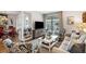 Comfortable living room featuring a neutral colored couch and armchairs, and a view of the dining area at 1637 Live Oak Park, Seabrook Island, SC 29455