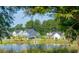 Community view with houses around a pond at 1020 Lovebug Ln, Summerville, SC 29485