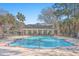 Community pool with clubhouse and landscaping at 1025 Riverland Woods Pl # 610, Charleston, SC 29412