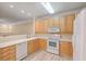 Light wood kitchen cabinets and white appliances at 1025 Riverland Woods Pl # 610, Charleston, SC 29412