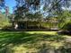 Brick ranch house with a large front porch and yard at 1229 Central Ave, Summerville, SC 29483